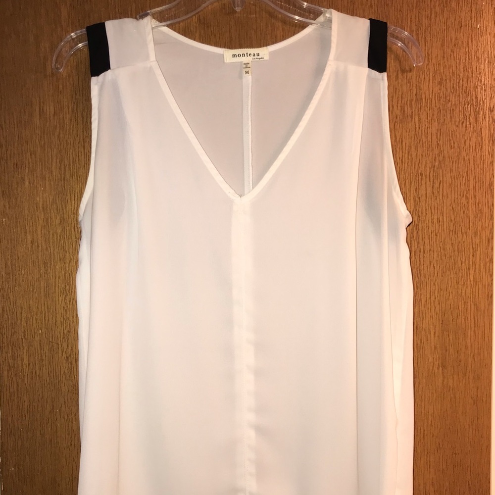 White sleeveless blouse with black accents